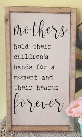 Mother’s hold their children’s
